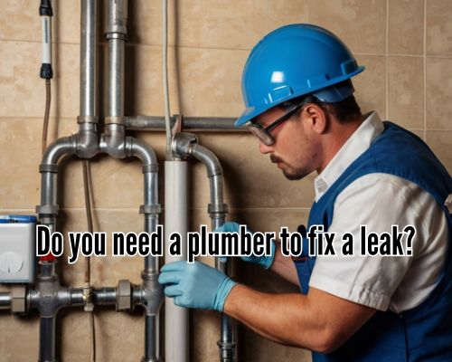 Close-up of a plumber repairing a pipe leak